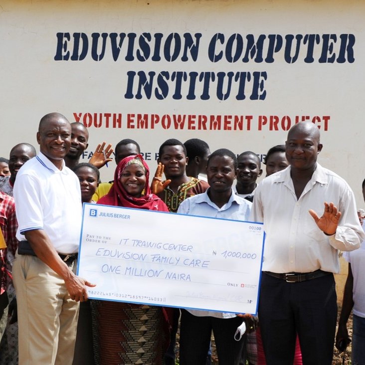 Group of people holds a donation cheque